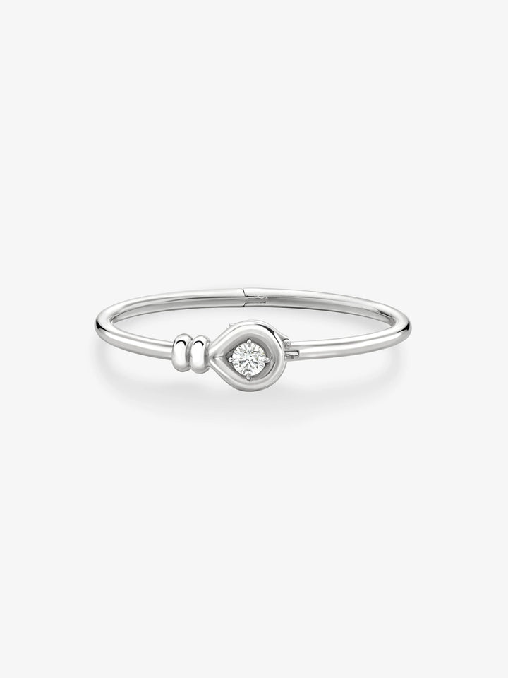 Jessica McCormack Forget Me Knot white gold bangle with a 0.80ct round brilliant diamond.