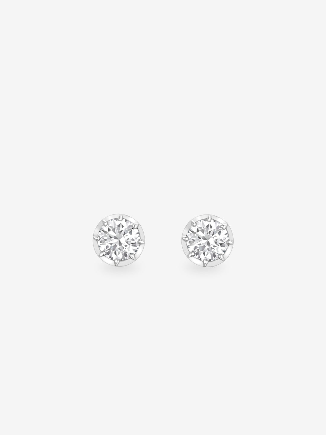 A pair of classic white gold stud earrings featuring round diamonds set in a traditional handcrafted style, reflecting timeless elegance and fine craftsmanship.  View 1