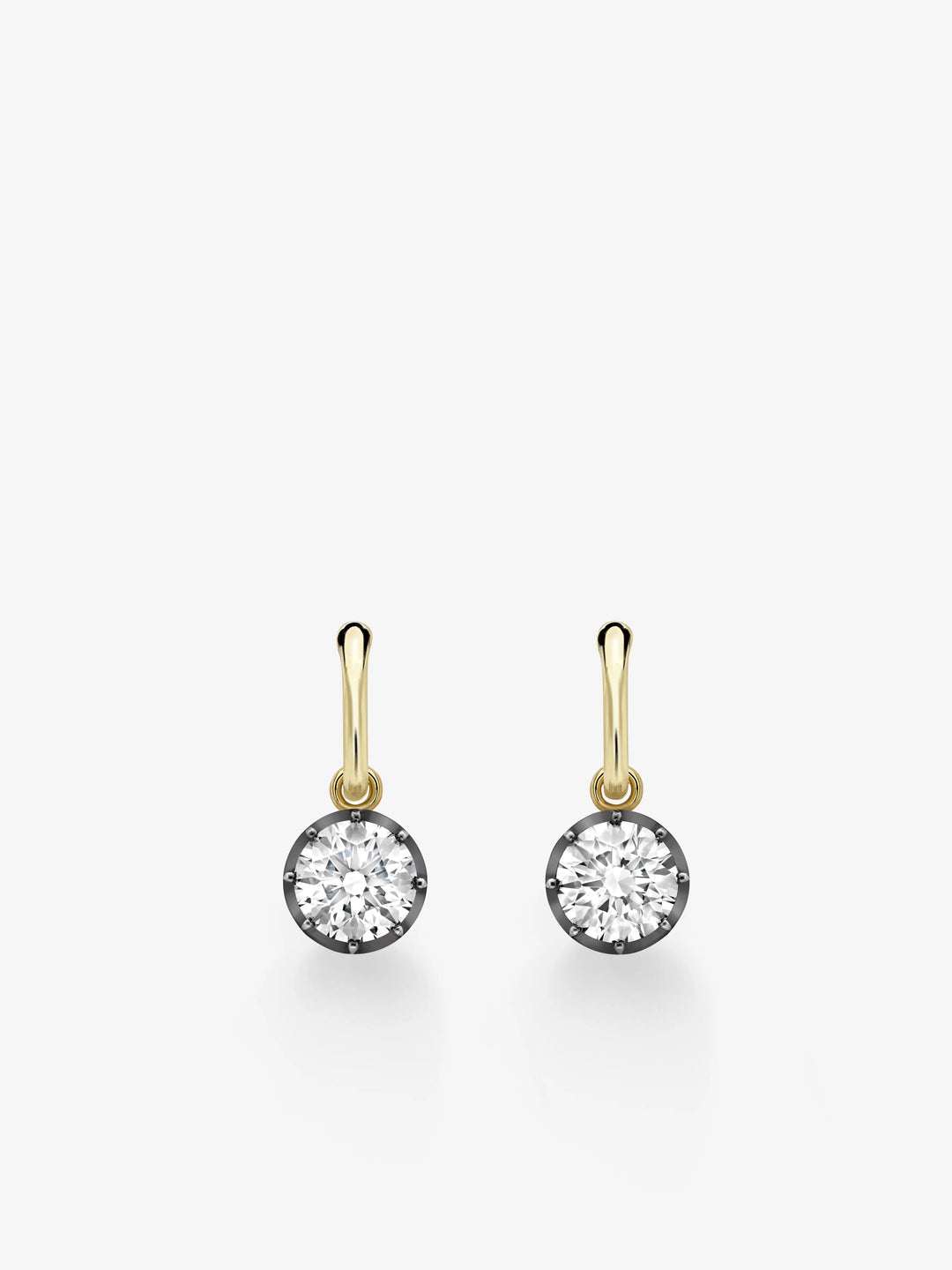 Pair of hoop earrings featuring round diamonds set in blackened gold, with yellow gold hoops showcasing a blend of antique-inspired and contemporary craftsmanship.  View 1