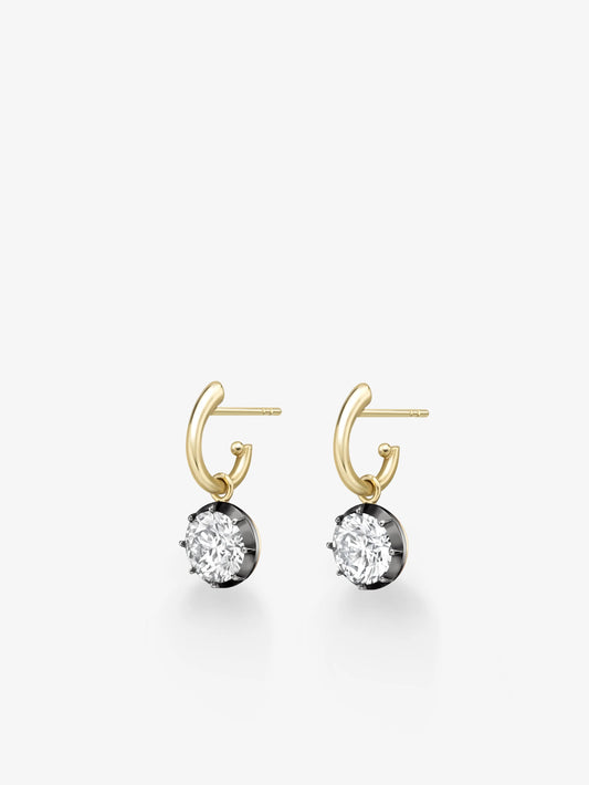 Pair of contemporary hoop earrings in yellow gold featuring round-cut diamonds set in blackened gold, showcasing a blend of antique inspiration and modern craftsmanship. View 2