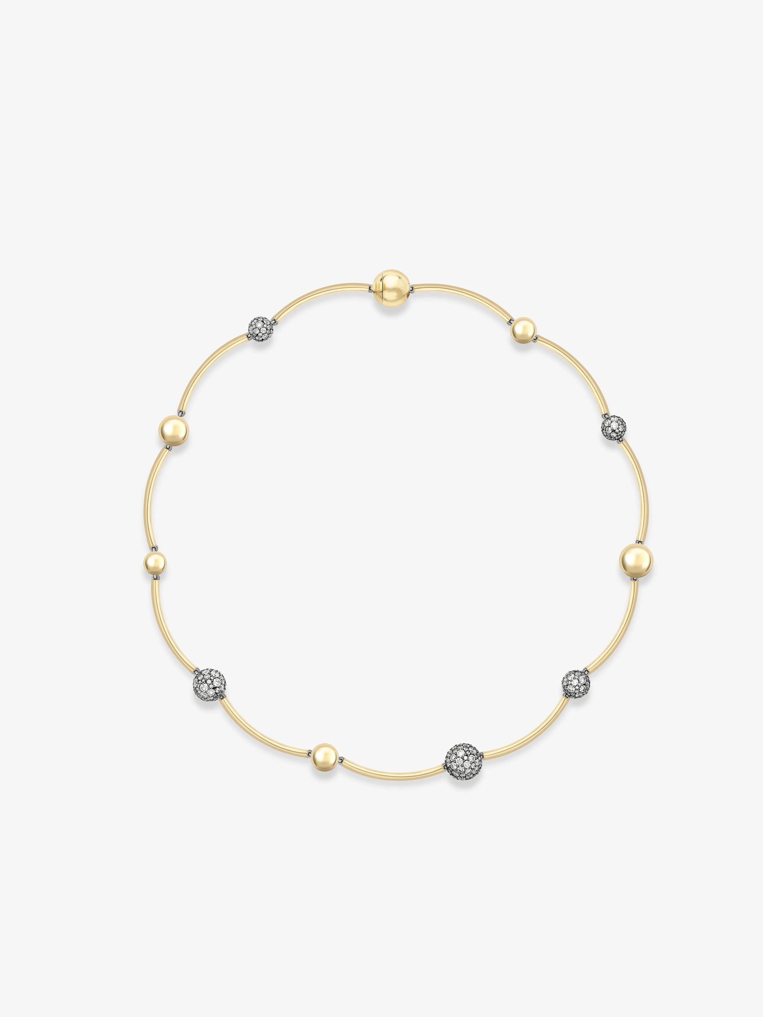 Delicate yellow gold necklace featuring a circle of alternating smooth spheres and pavé diamond spheres, showcasing refined craftsmanship with a contemporary yet timeless design. View 1