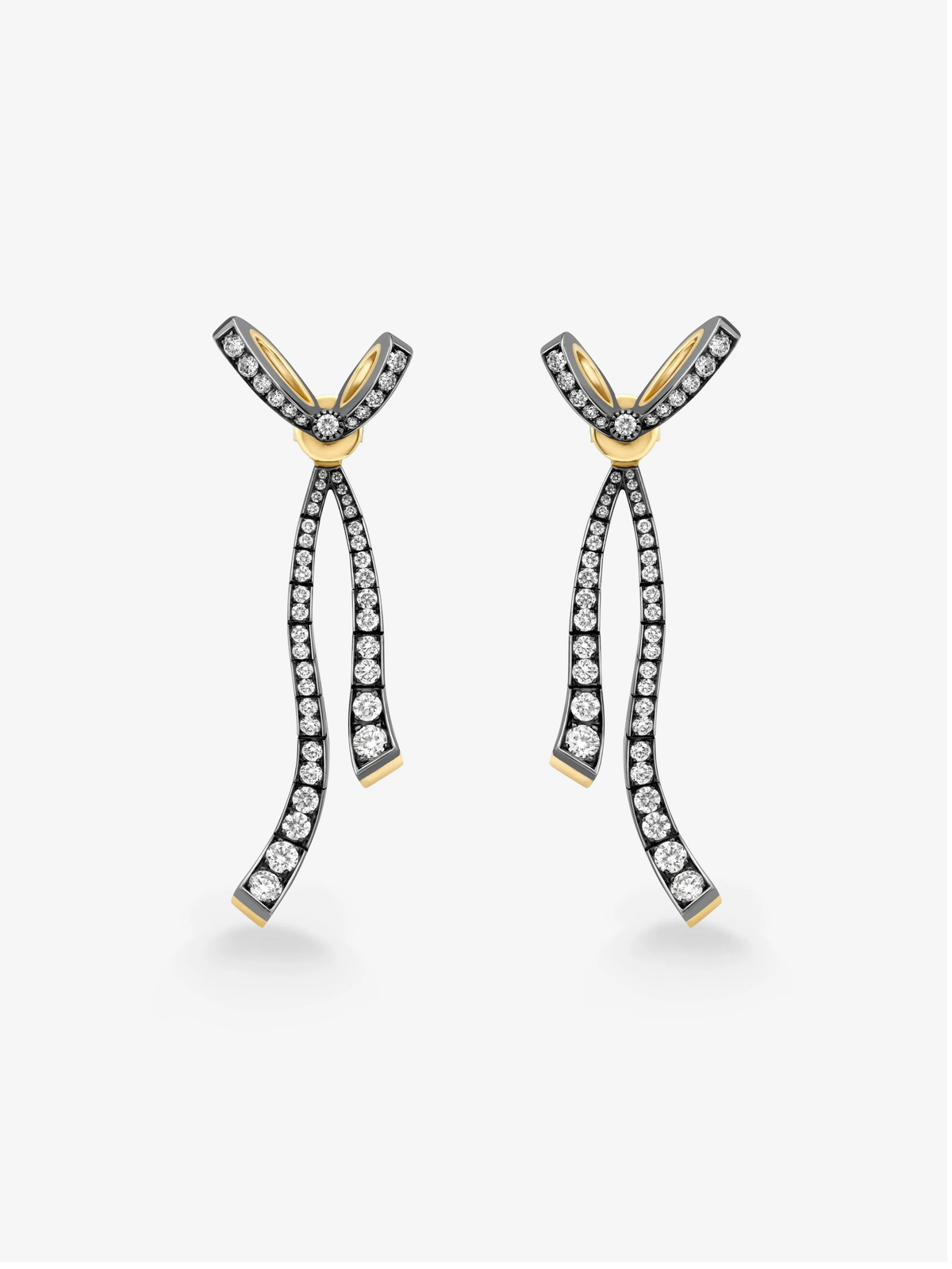 Pair of diamond drop earrings in blackened and yellow gold with sculptural bow inspired ribbon forms and graceful curved drops View 1