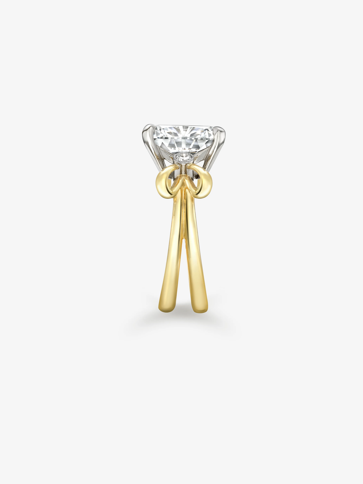 Cushion cut diamond ring with a sculptural bow setting, contrasting white and yellow gold details, showcasing Jessica McCormack craftsmanship View 3