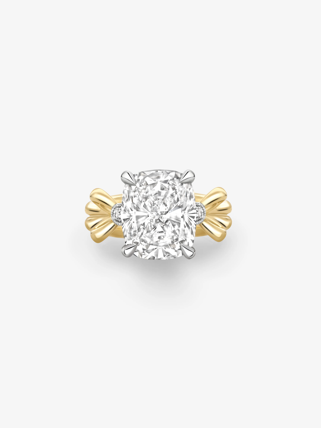 Cushion cut diamond ring featuring a 5.11ct centre diamond in a white metal setting, with sculptural yellow gold bow-inspired shoulders.  View 1