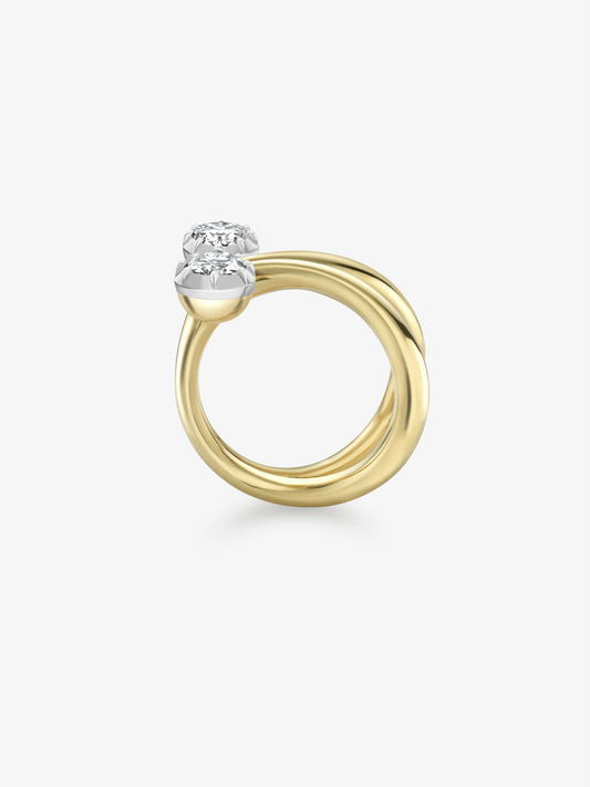 Pear shaped diamond ring with a polished yellow gold band and contrasting white gold setting, showcasing contemporary style and traditional craft techniques View 4