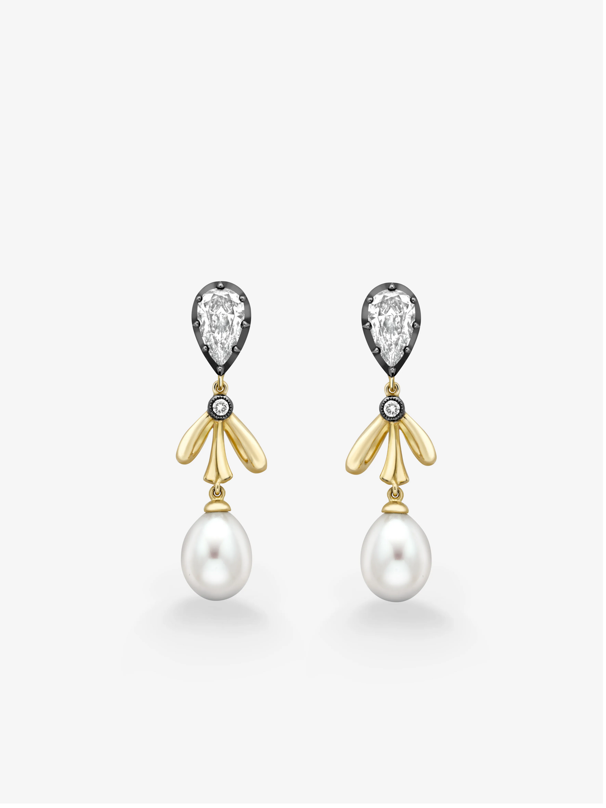 Pear shaped diamond and yellow gold bow drop earrings finished with large lustrous pearl drops by Jessica McCormack View 1