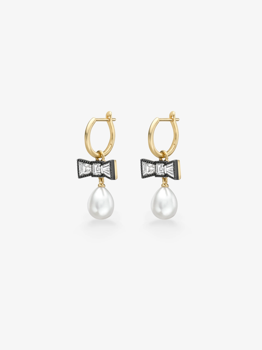 Jessica McCormack gold hoop earrings with blackened diamond bows and dangling white pearls, blending antique-inspired details with contemporary style View 2