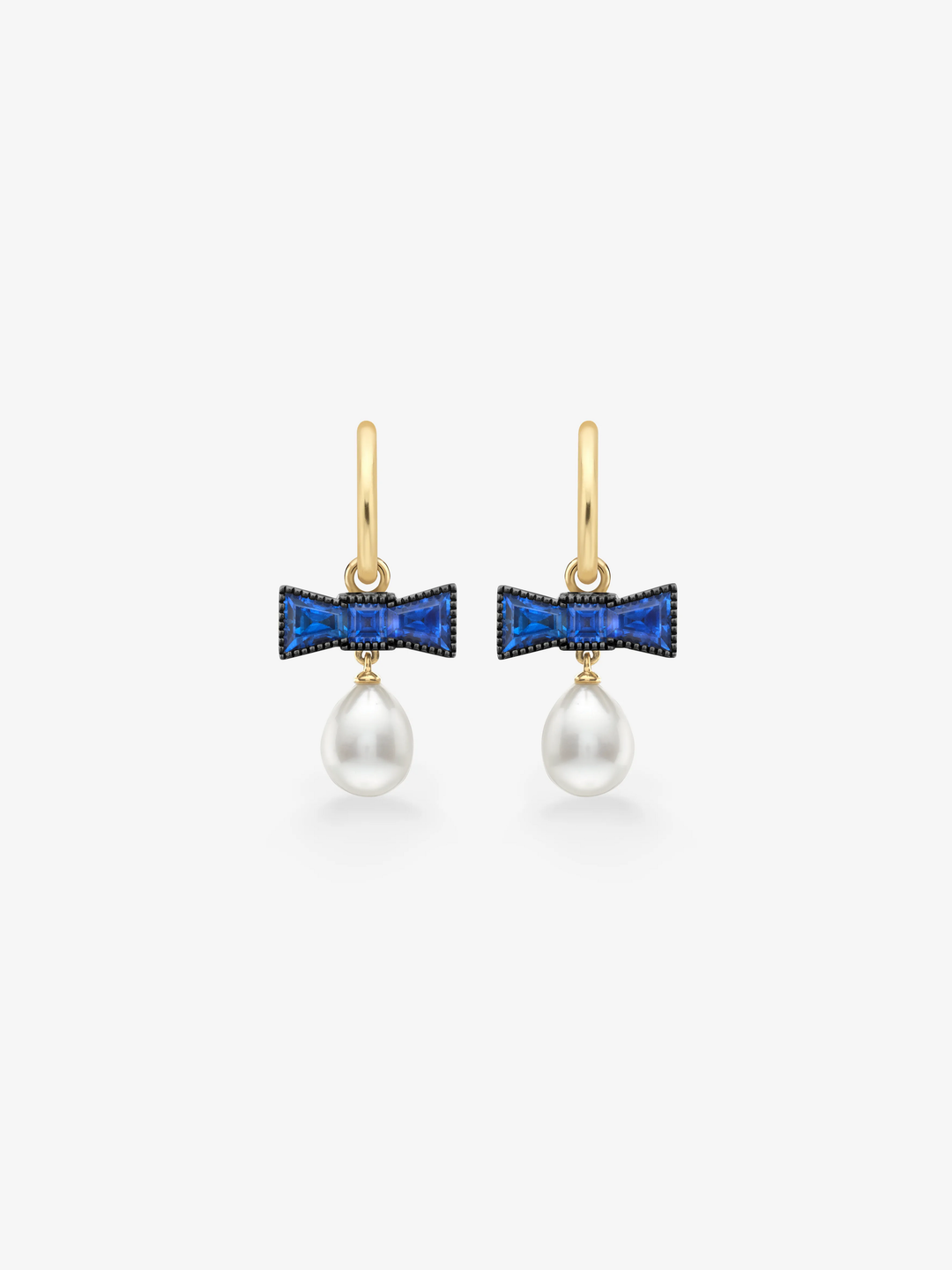 Jessica McCormack sapphire bow earrings with vivid blue stones and lustrous pearl drops on gold ear wires  View 1
