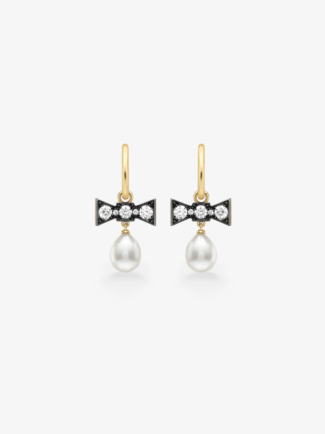 Jessica McCormack bow drop earrings in gold, featuring diamond set blackened bows and luminous white pearl drops.  View 1