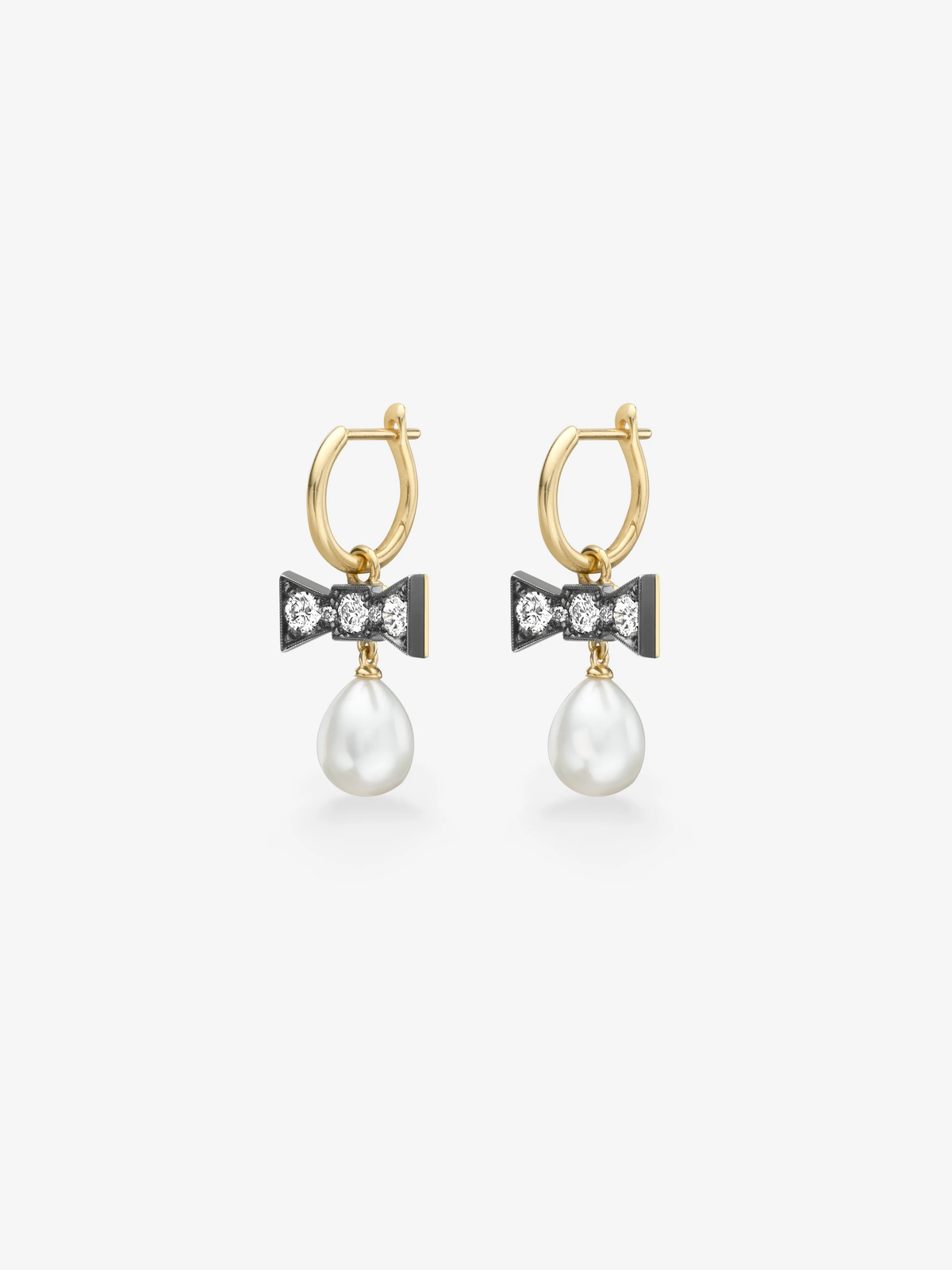 Gold hoop earrings with blackened bow details set with round brilliant cut diamonds and dangling white pearls in a contemporary gypset design View 2