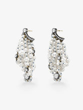 Pair of pearl and diamond drop earrings with clustered white pearls, round diamonds and blackened gold bow details against a white background