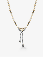 Diamond ribbon pendant necklace with a beaded gold chain and two elongated diamond set tails in a contemporary bow inspired design