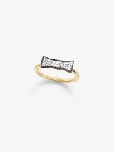 Bow shaped diamond ring with blackened gold detailing and a polished gold band, showcasing Jessica McCormack antique inspired contemporary style