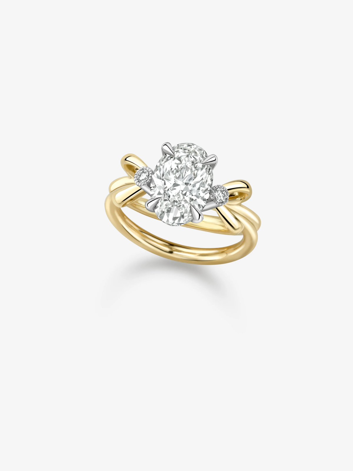 Oval cut diamond ring with a bow inspired yellow gold band and contrasting white gold setting showcasing a central 3.01ct diamond View 2