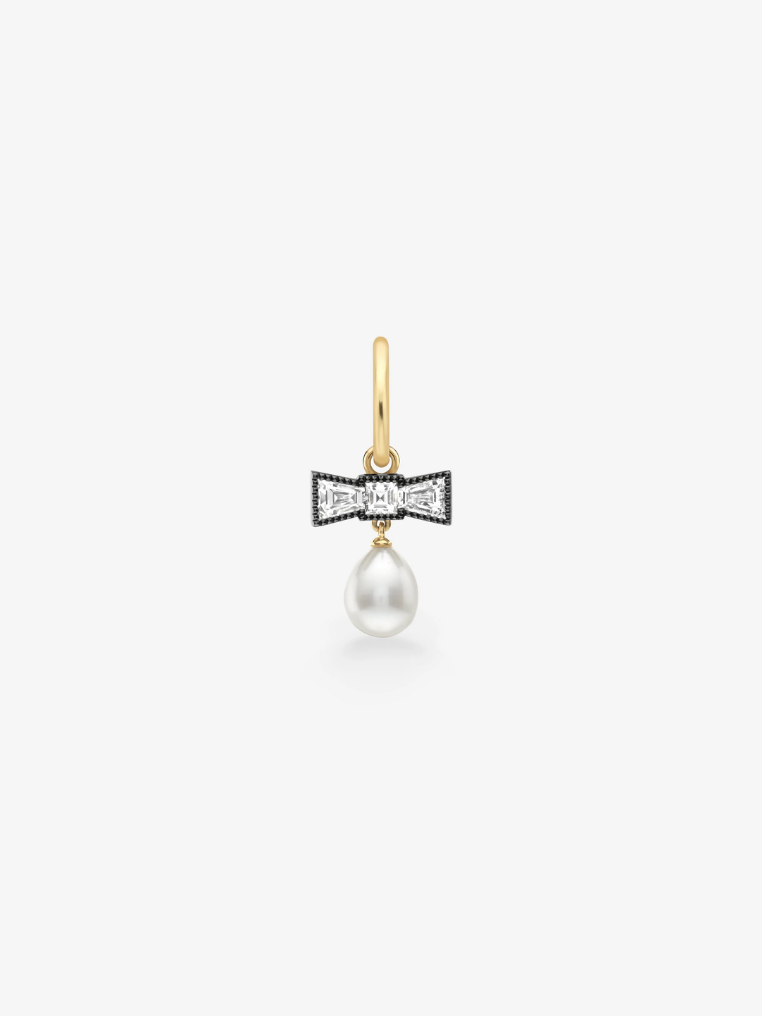 Jessica McCormack single hoop earring in gold with a diamond bow motif and dangling white pearl, showcasing antique inspired craftsmanship and contemporary style  View 1