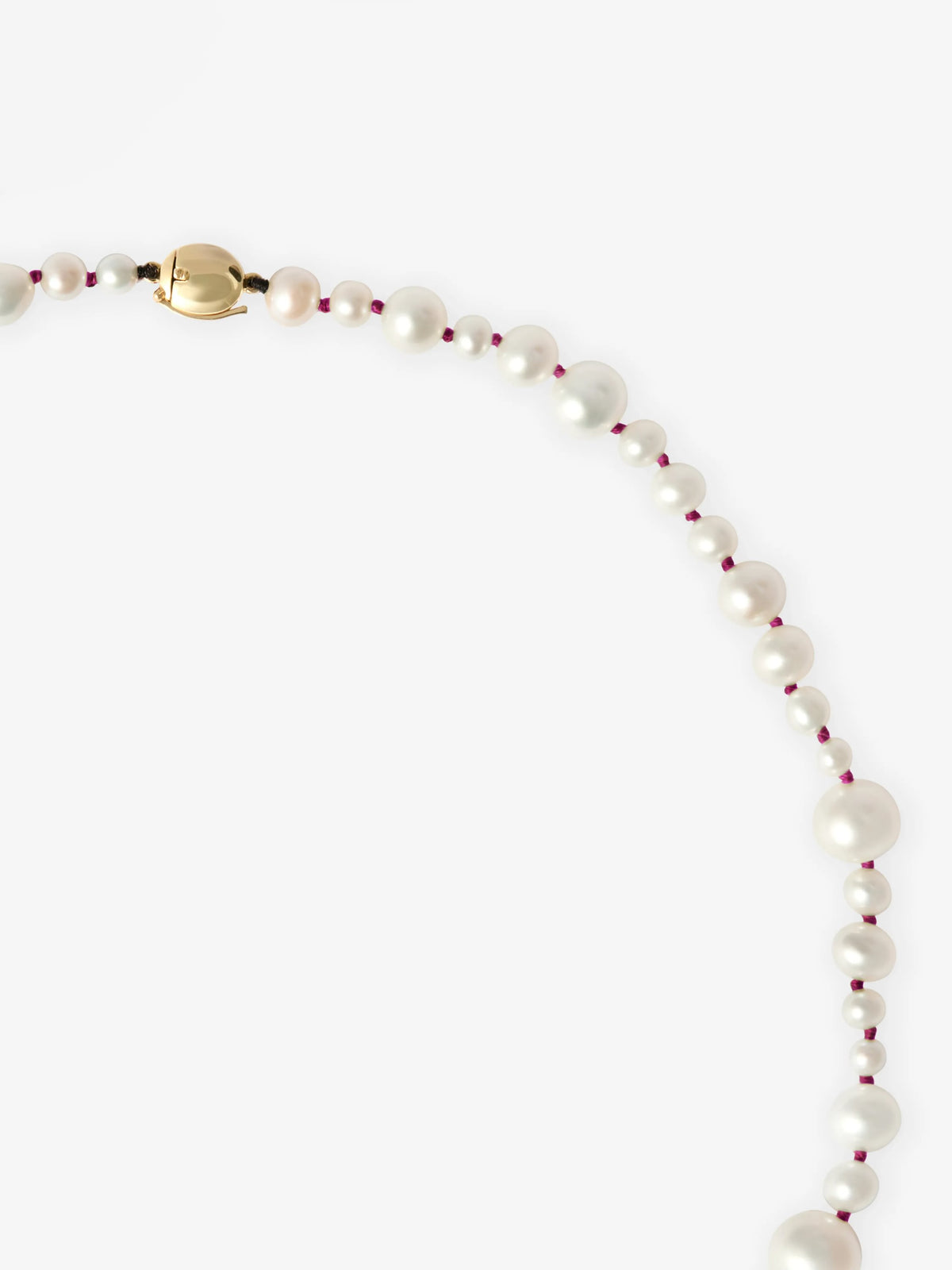 Jessica McCormack Beaches pearl necklace with pink thread accents, graduated pearls, a gold clasp and 0.40ct diamond detail on a white background View 2