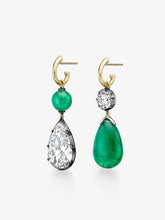 Pair of asymmetric hoop earrings featuring cabochon emerald and pear-shaped diamond drops, set in yellow gold with hand-crafted antique-inspired detailing.