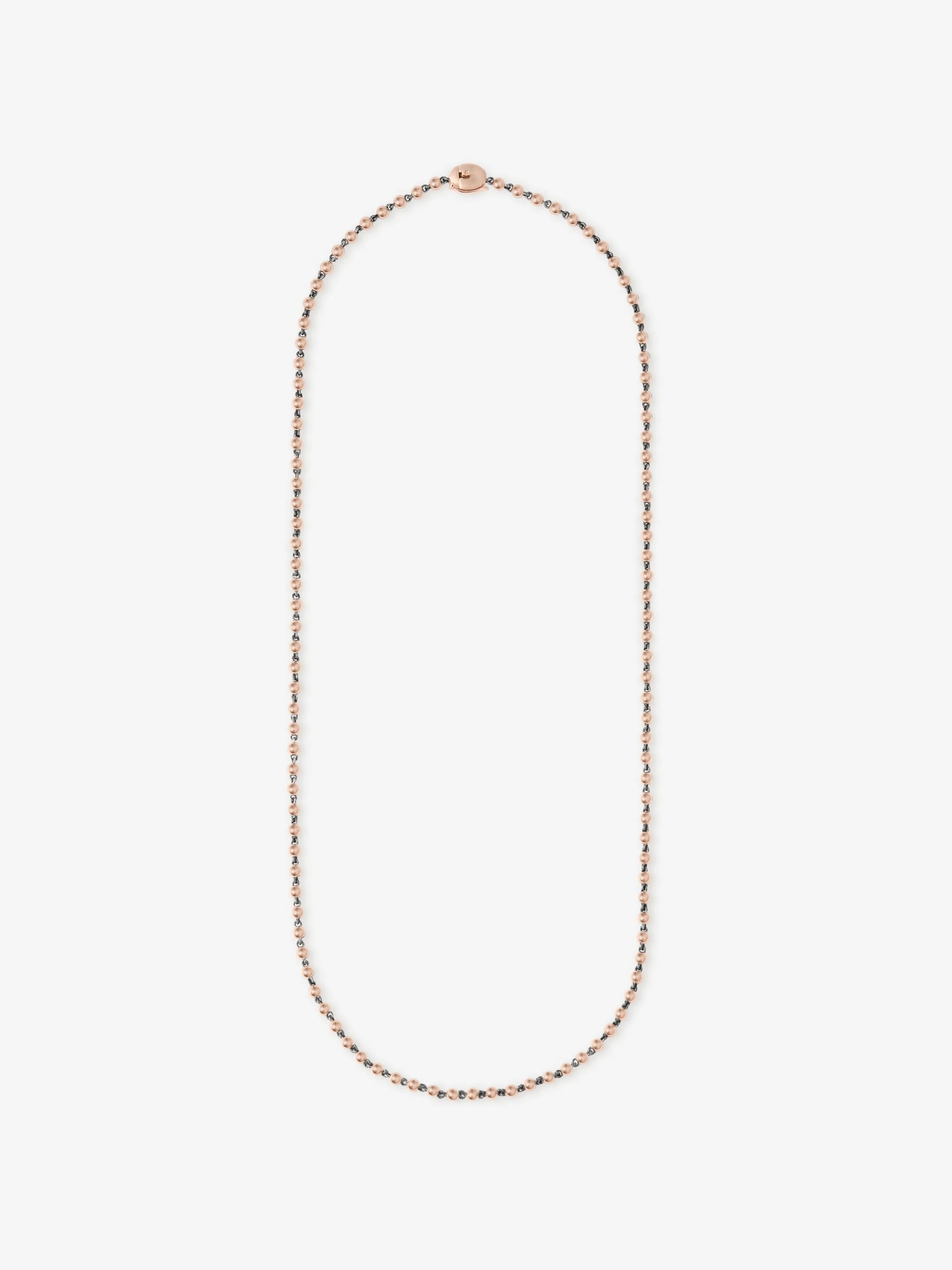 Delicate rose gold micro ball chain necklace crafted with traditional goldsmithing techniques, featuring a minimalist and contemporary design. View 1