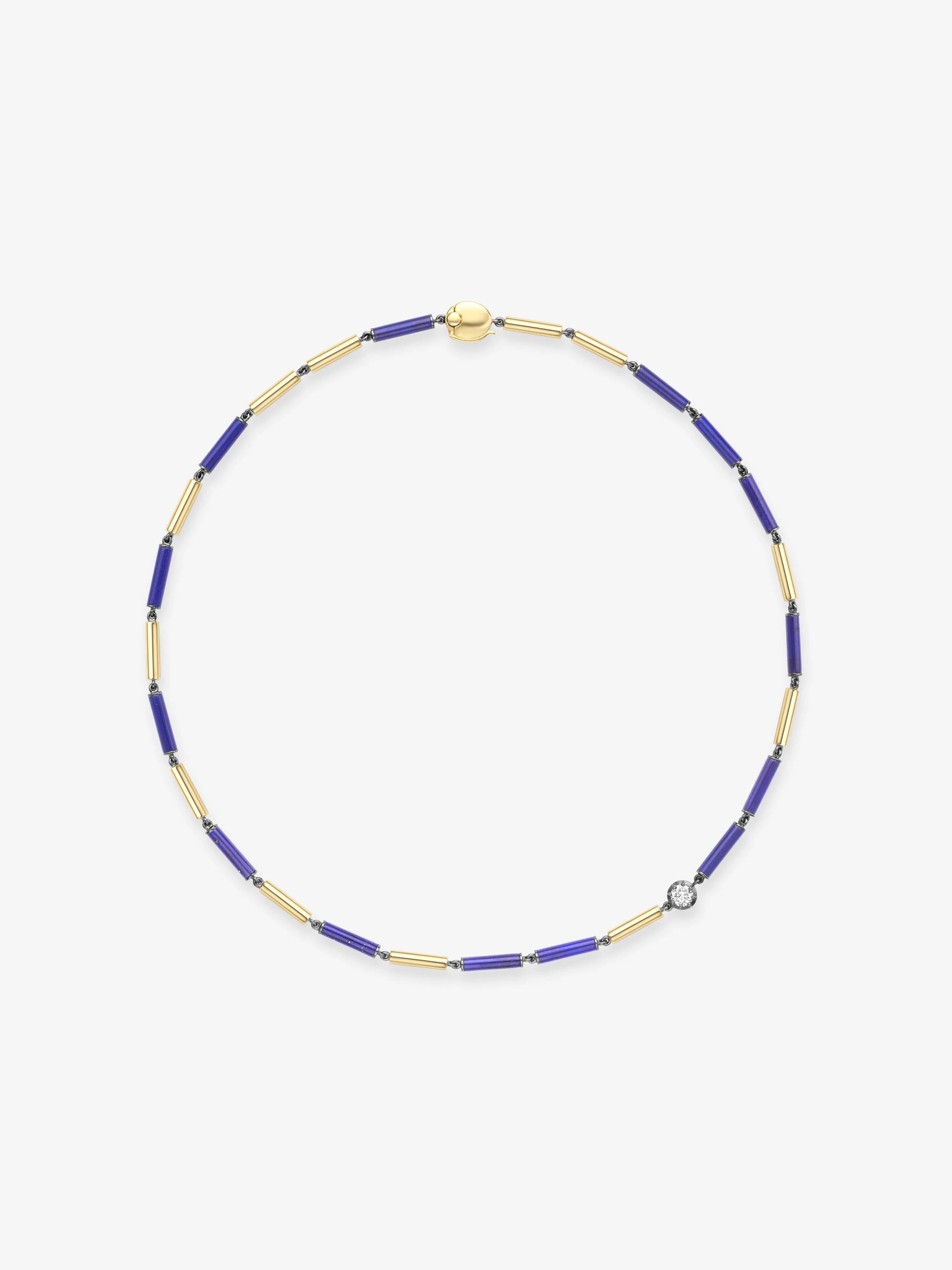 Delicate necklace featuring elongated blue lapis beads and gold links, accented with a single diamond, showcasing artisanal craftsmanship and contemporary design. View 1
