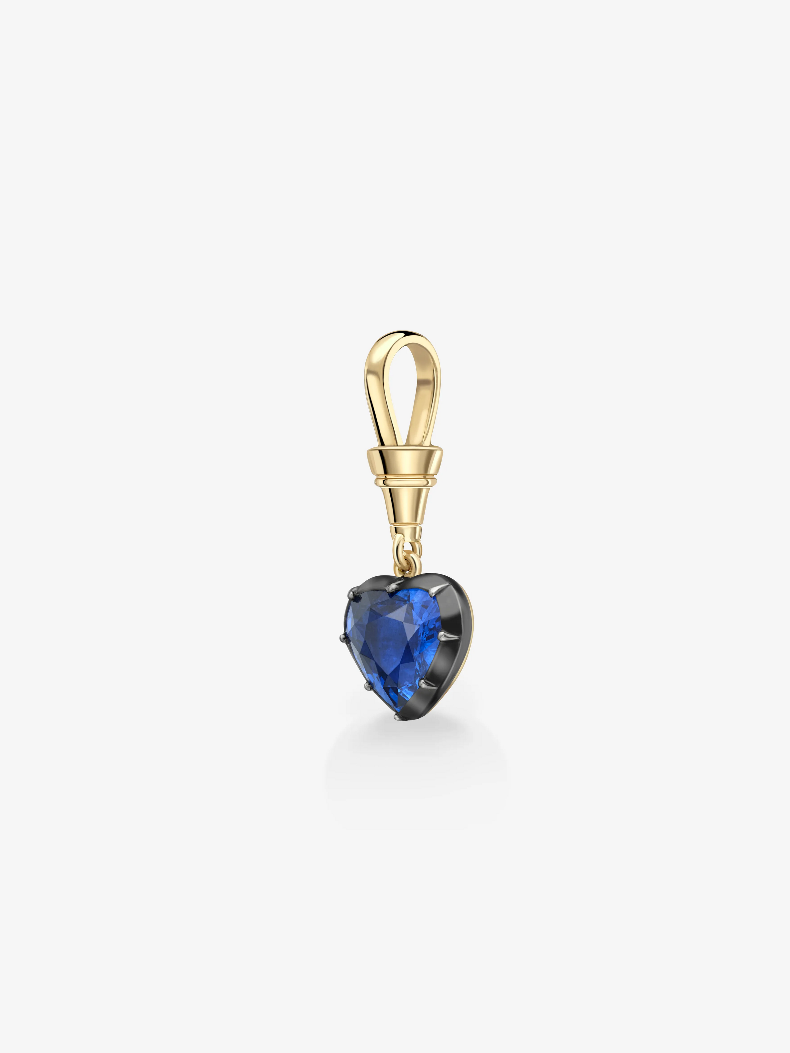Heart-shaped deep blue sapphire pendant set in polished yellow gold, combining antique-inspired artistry with contemporary design. View 3