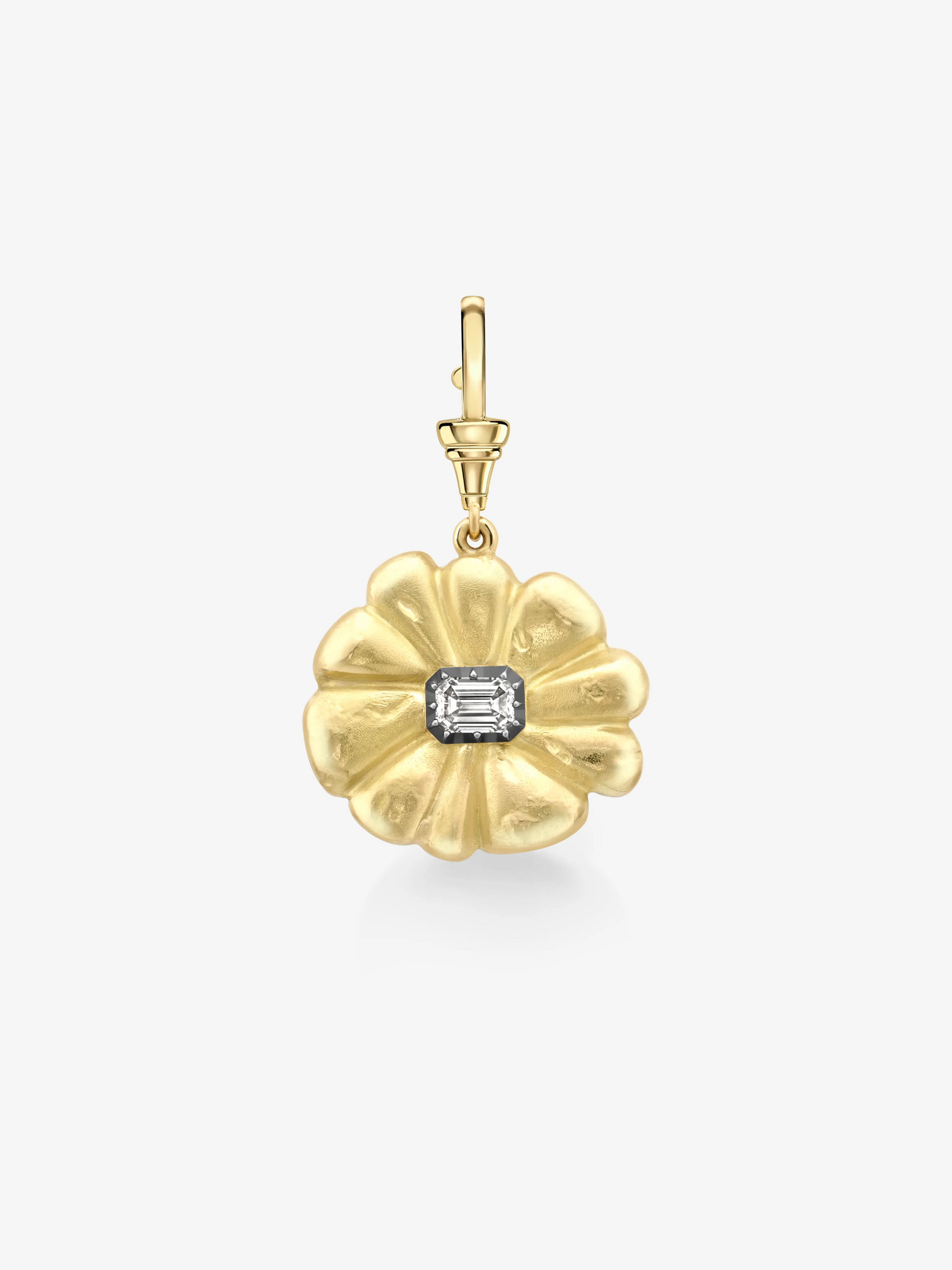 Gold pendant with a central gemstone on a white background View 1