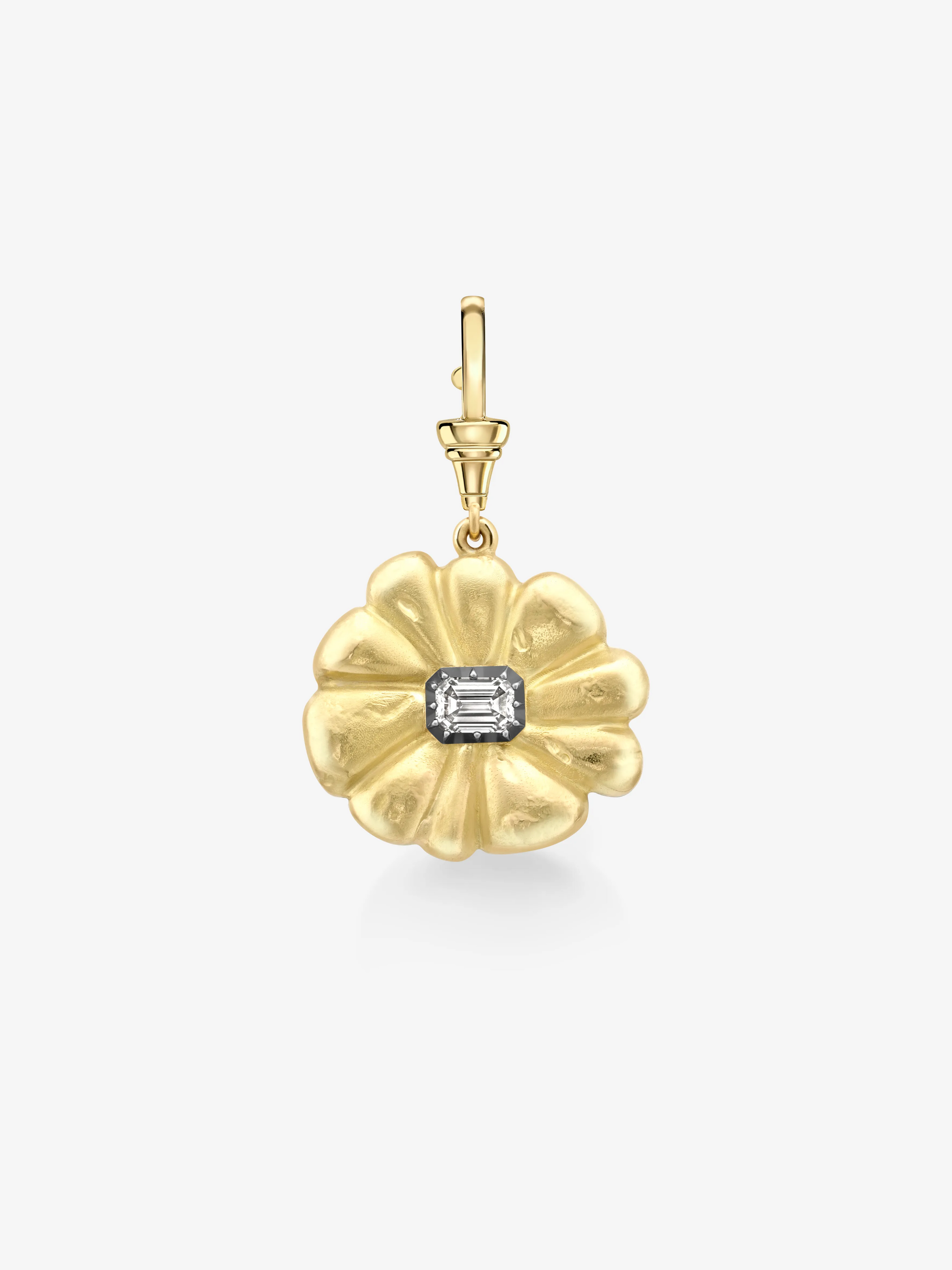 Gold pendant with a central gemstone on a white background View 1
