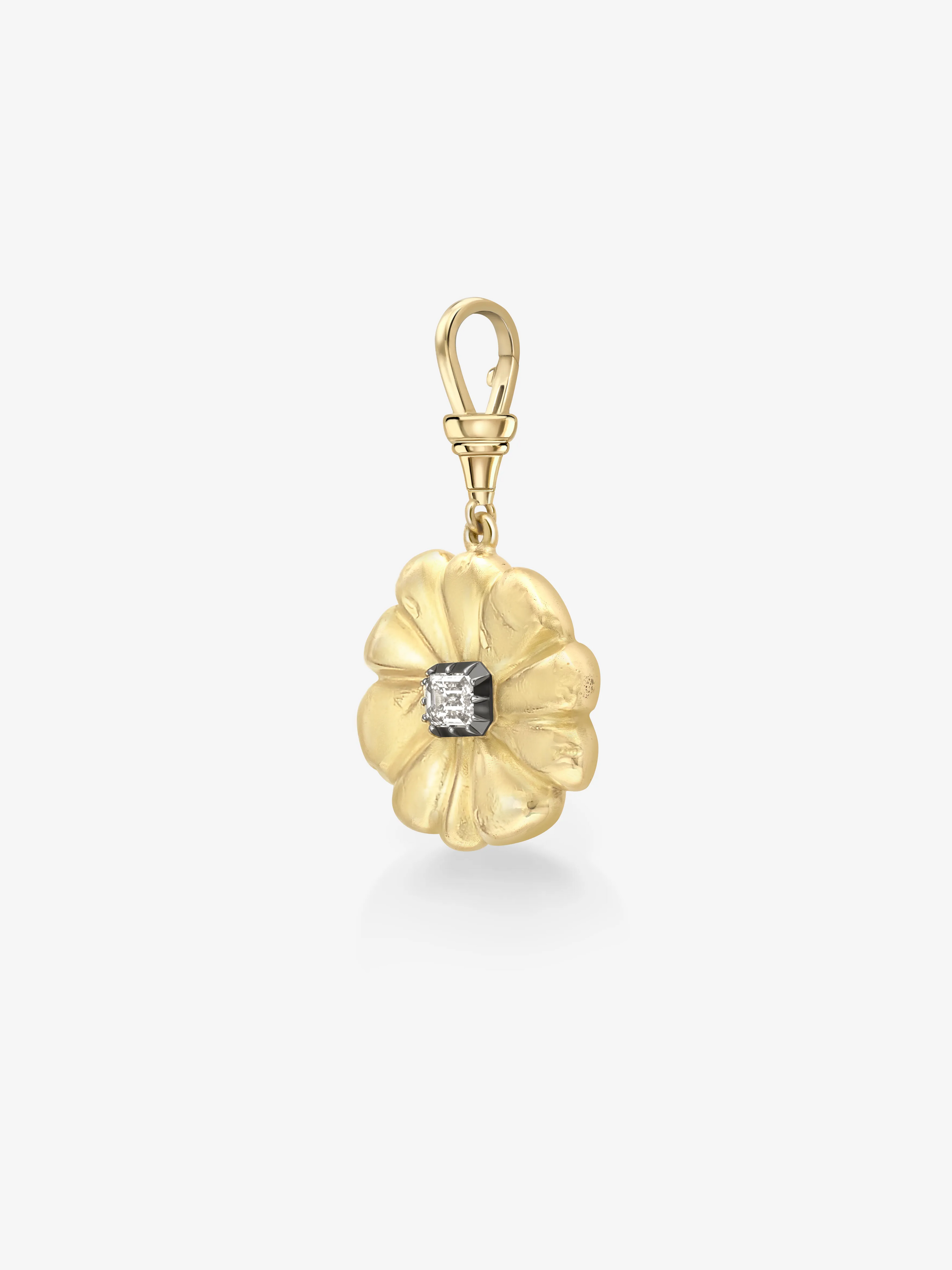 Gold flower-shaped pendant with a central gemstone on a white background View 4