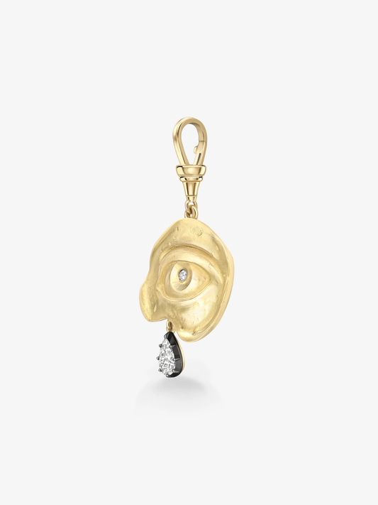 Gold pendant with eye design and black gemstone on a white background View 5