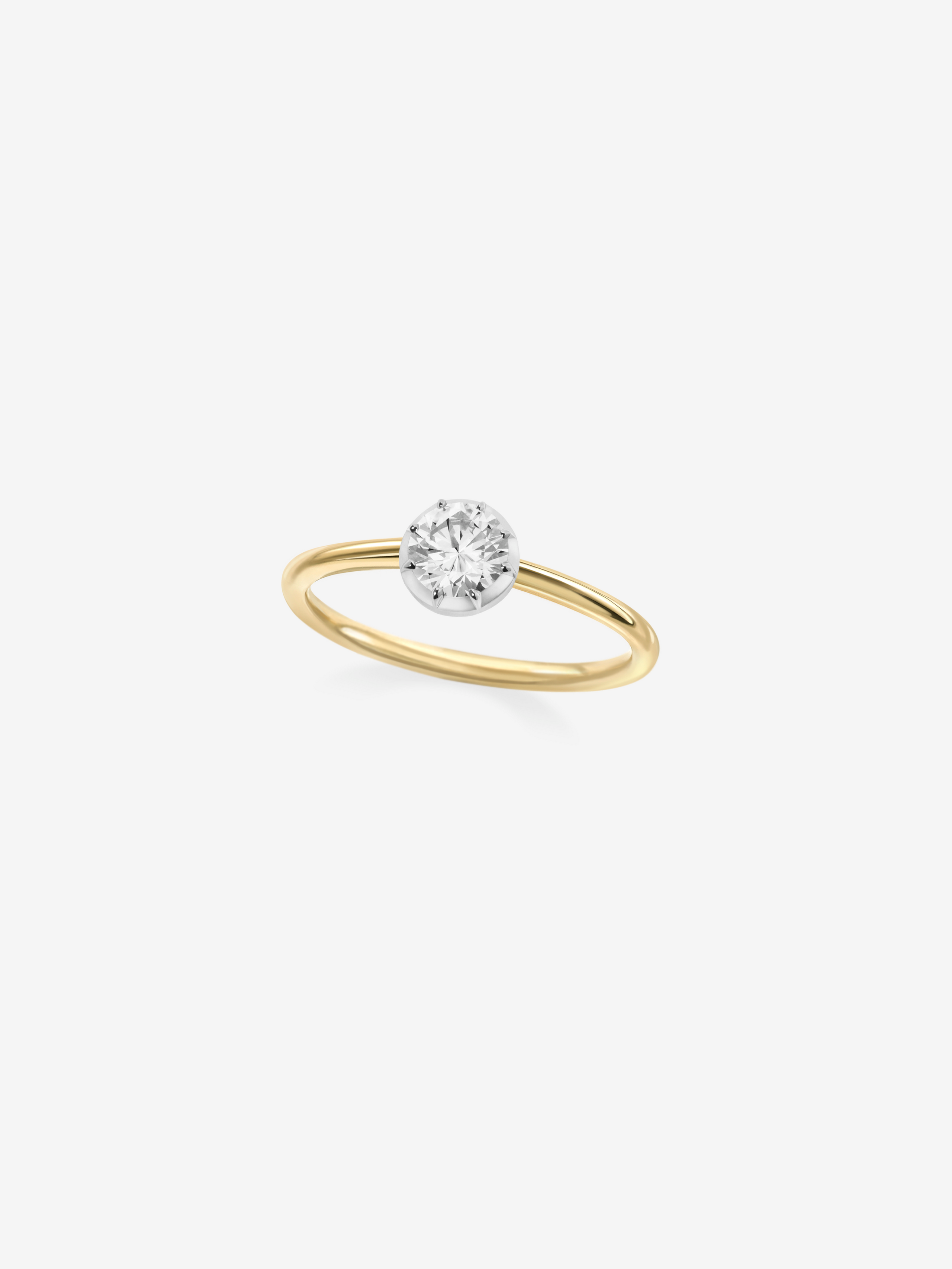 Delicate yellow gold ring featuring a 0.50ct diamond in a sleek, hand-crafted white gold bezel setting, blending antique inspiration with contemporary elegance. View 2