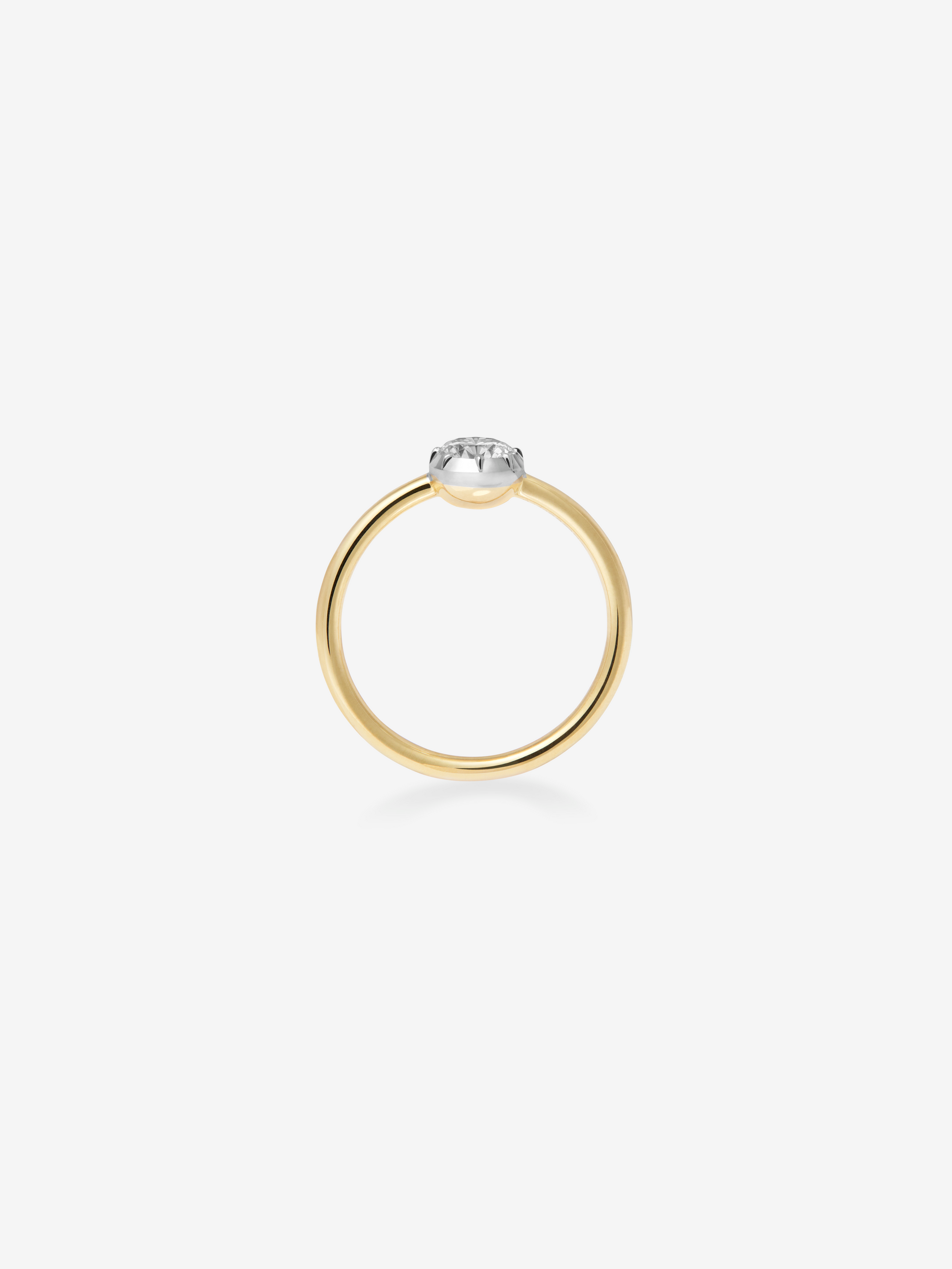 Delicate yellow gold ring featuring a contemporary button back setting with a 0.50ct diamond, blending traditional craftsmanship with modern elegance. View 4