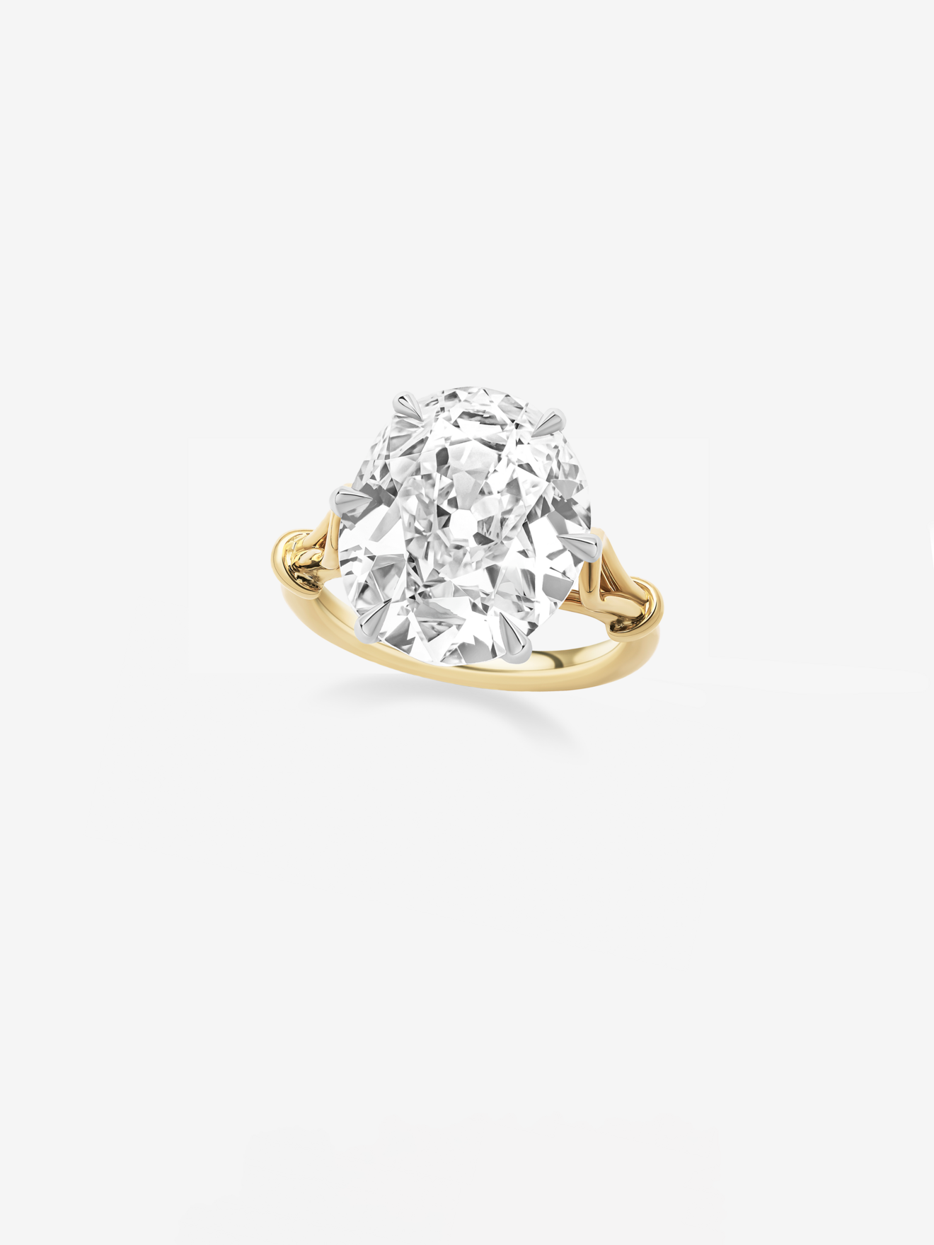 Oval diamond ring featuring a 9.33-carat stone set in a yellow gold band with an elegant, antique-inspired looping design. View 2